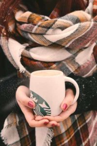 Snuggled up in a blanket and Keeping warm with a hot True North Blend Blonde Roast from Starbucks