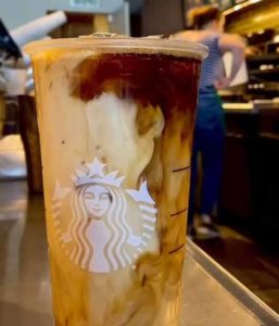 Creamer swirling through a Starbucks Vanilla Sweet Cream Cold Brew - Yummy!